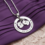 Close-up of Belle Fever Can't be replaced necklace showing engraved names and date, personalized keepsake jewelry for mothers