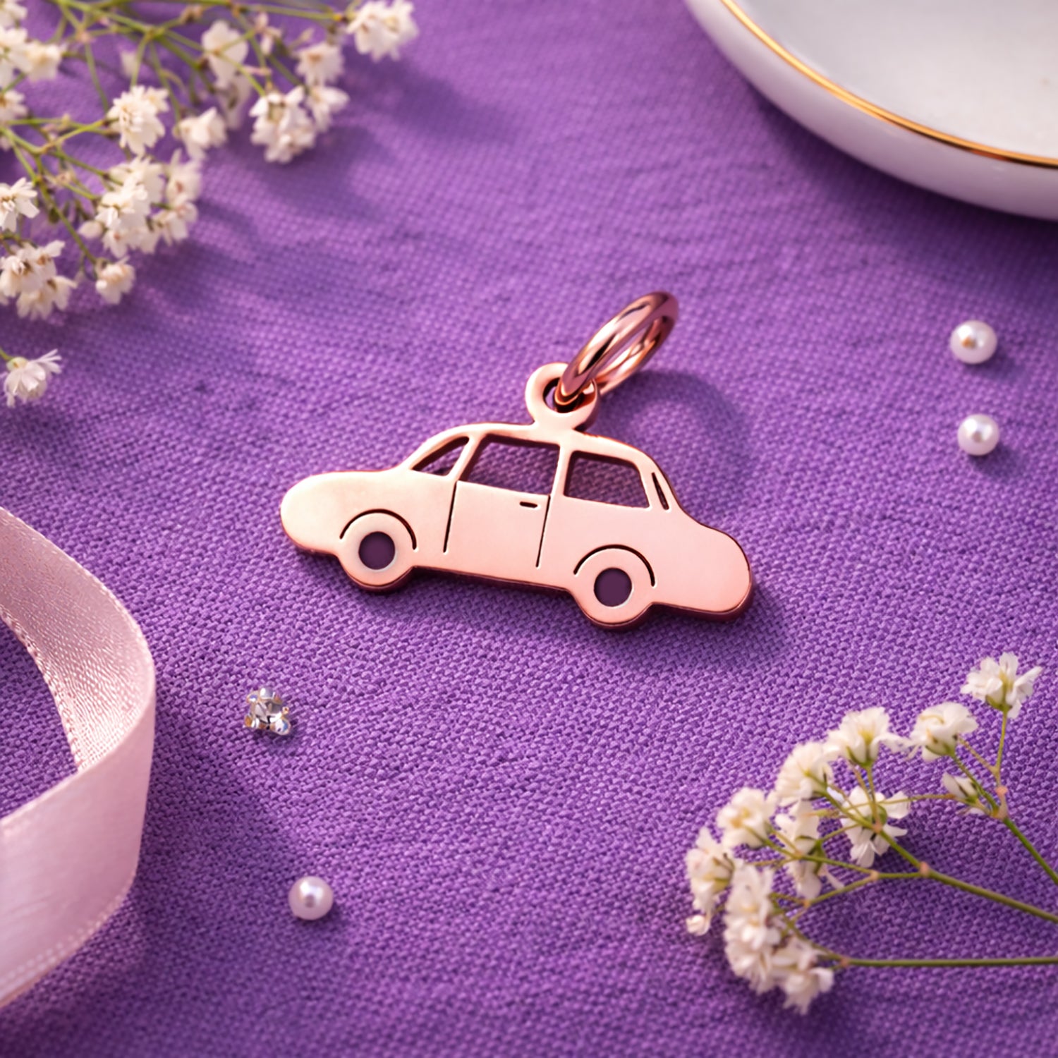 Belle Fever charm for keyring rose gold car pendant on purple fabric flat lay, feminine automotive keychain charm, aesthetic driver gift idea