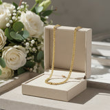 Gold curb chain necklace, waterproof non-tarnish unisex jewelry displayed elegantly, timeless everyday statement chain.