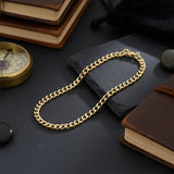 Gold curb chain bracelet, waterproof non-tarnish unisex jewelry displayed elegantly, timeless everyday statement chain.
