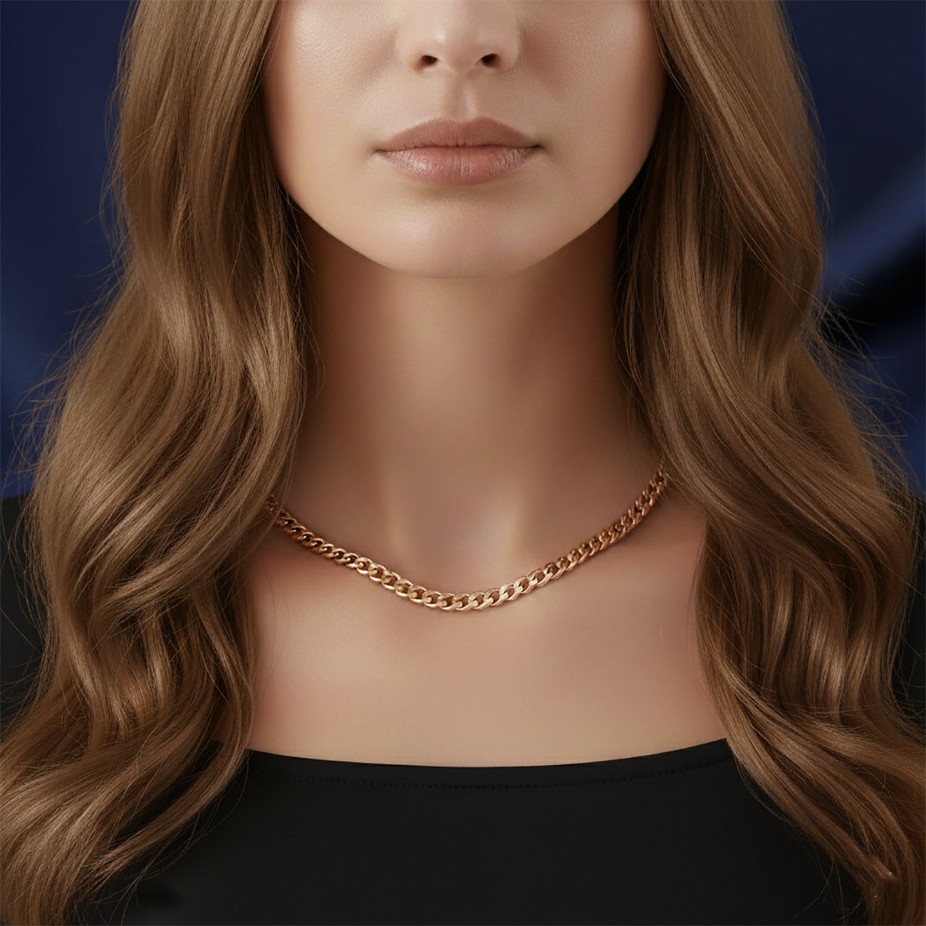 Close-up gold curb chain necklace on woman, waterproof non-tarnish unisex jewelry with sleek modern finish.