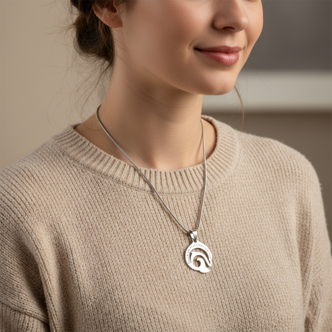 Personalized dolphin necklace worn by model, elegant belle fever engraved message pendant symbol of strength and freedom.
