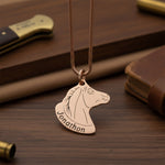 Belle Fever Horse Head Necklace with Custom Name gold pendant on rich brown leather background, custom engraved horse jewellery, personalised equestrian necklace gift.