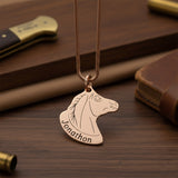 Belle Fever Horse Head Necklace with Custom Name gold pendant on rich brown leather background, custom engraved horse jewellery, personalised equestrian necklace gift.