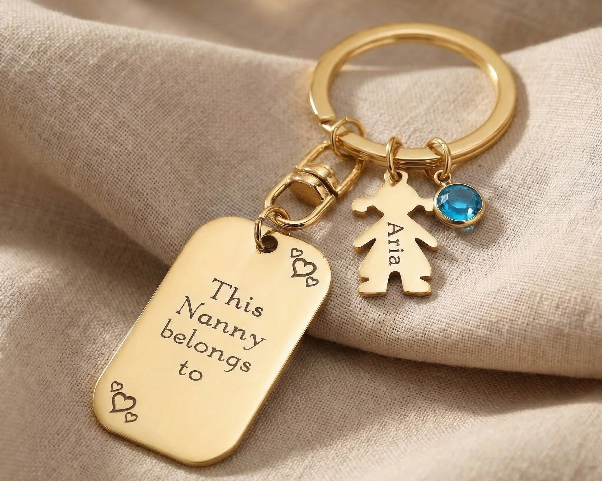 Kids personalised tag keyring in gold with engraved message, child charm and birthstone