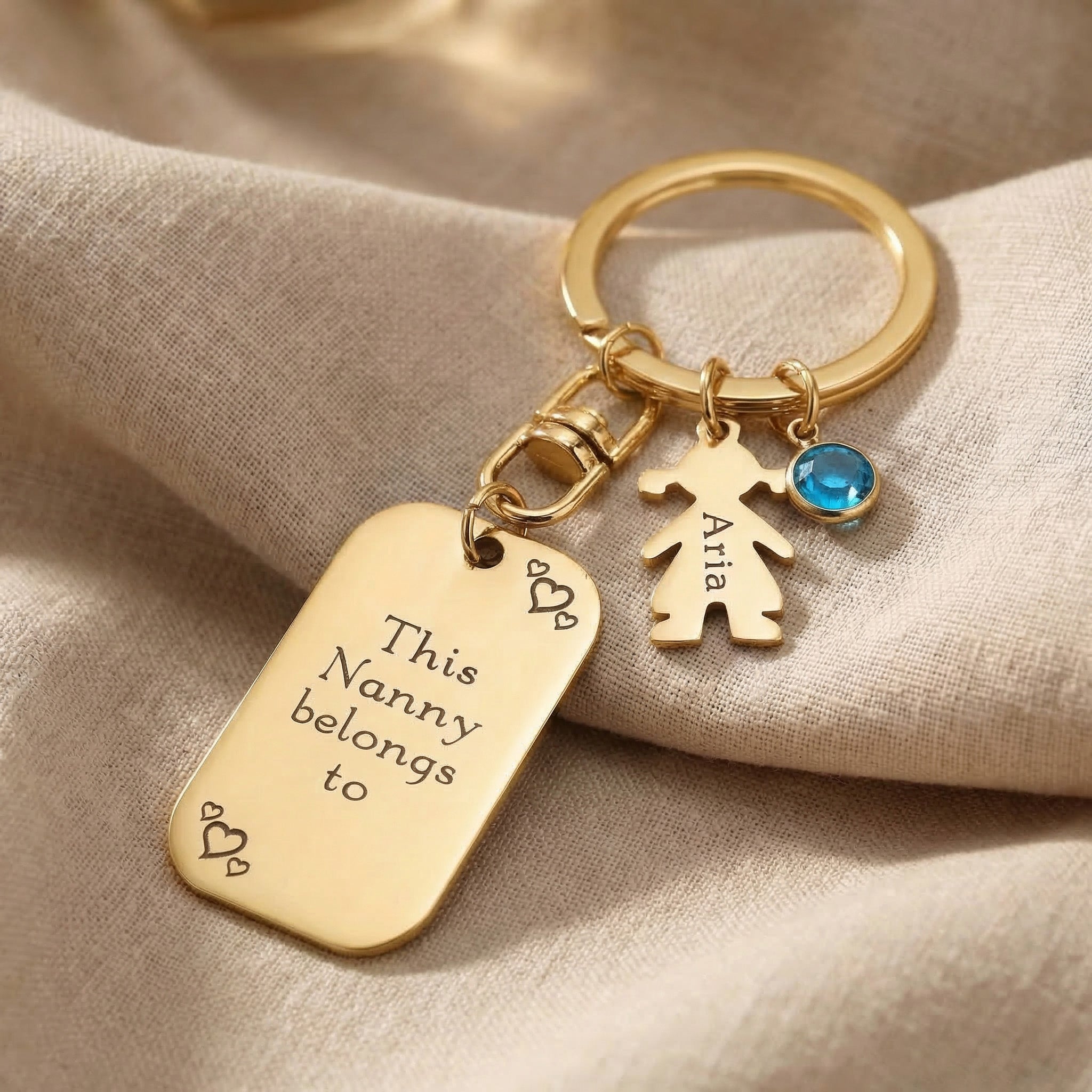 Kids personalised tag keyring in gold with engraved message, child charm and birthstone