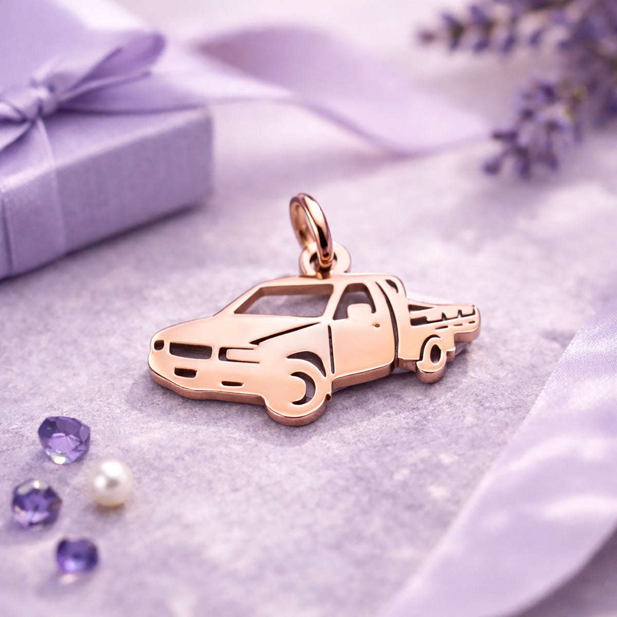 Belle Fever rose gold pick up charm on lavender flat lay, elegant truck lover gift keyring keepsake.