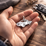 Belle Fever silver pick up charm in palm, personalized driver lover gift, truck keychain safe journey keepsake.