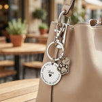 Personalized prints on my heart keyringhanging on bag with custom engraved paw and heart charms. belle fever remembrance gift for pet lovers.