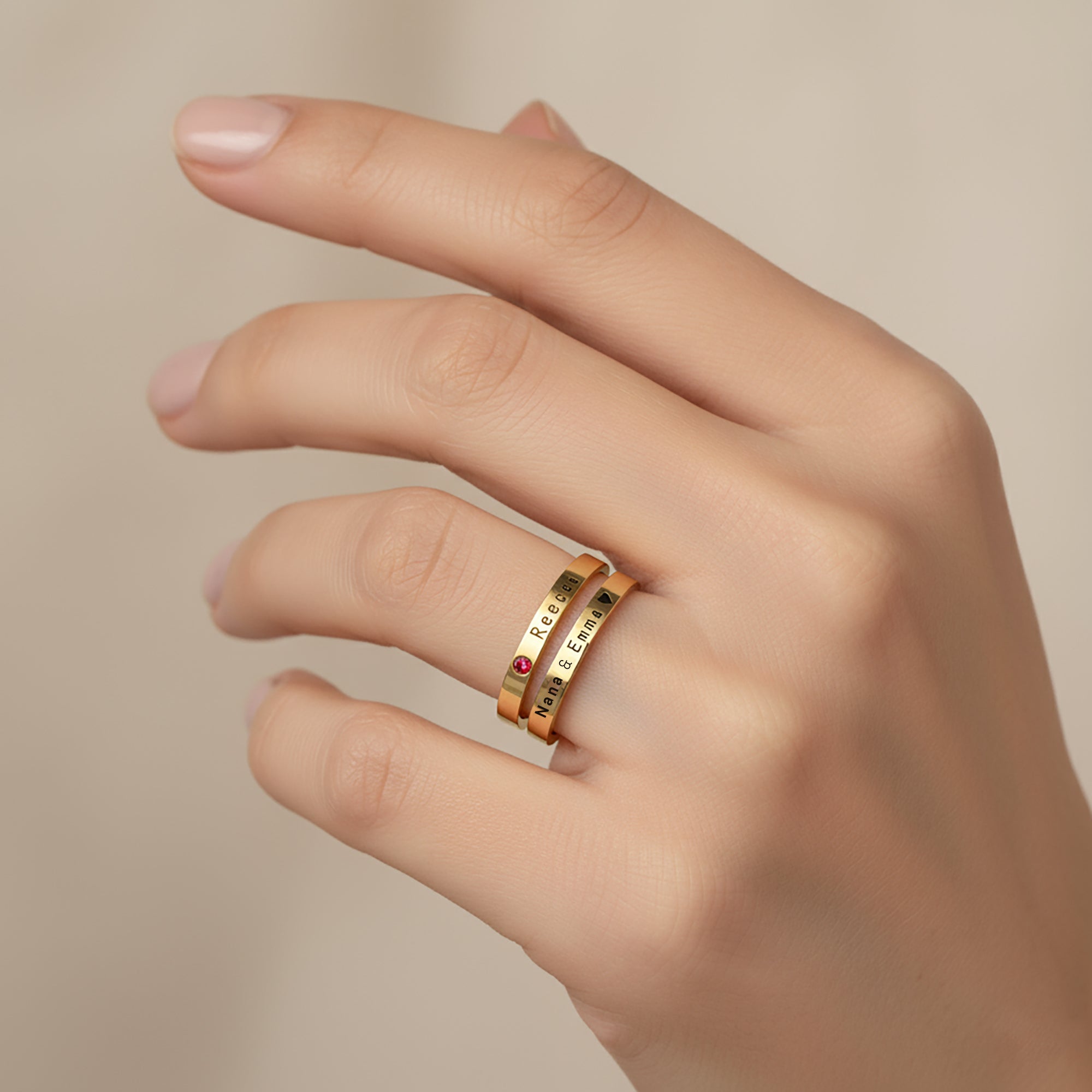Personalised Stackable Birthstone Rings worn together — Belle Fever’s elegant engraved bands with gemstones, celebrating loved ones and life’s meaningful moments.