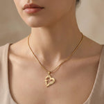 Model wearing Trust in Him necklace by belle fever, elegant Christian faith necklace with heart cross design for daily inspiration