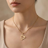 Model wearing Trust in Him necklace by belle fever, elegant Christian faith necklace with heart cross design for daily inspiration