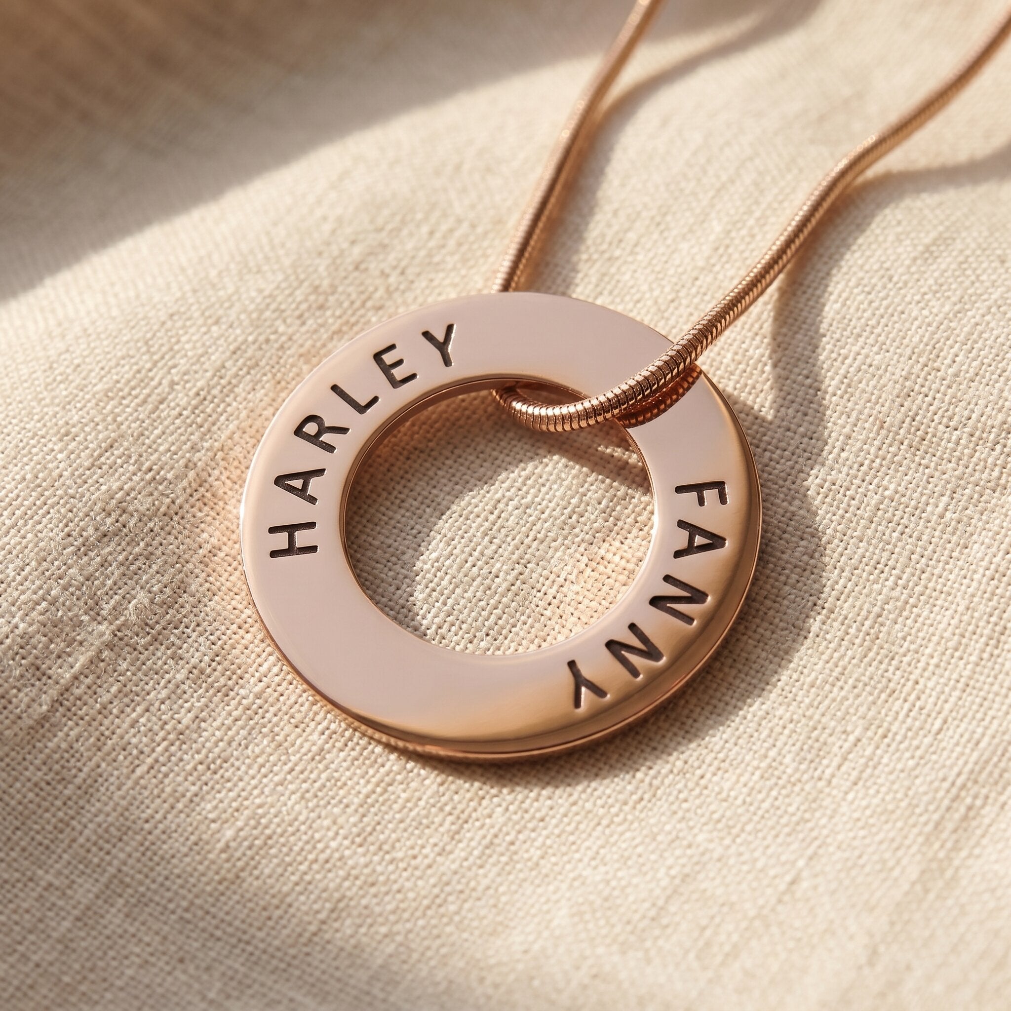 Always Forever necklace in gold with engraved names on circle pendant, refined personalised jewellery