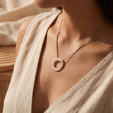 oman wearing Always Forever necklace with engraved circle pendant, elegant everyday style