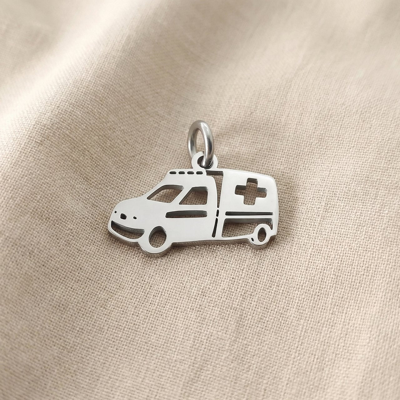 Silver ambulance charm for keyring honoring healthcare workers, emergency responders, and medical dedication
