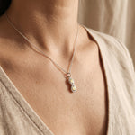 Woman wearing best friend necklace, elegant friendship jewellery symbolising connection and bond