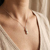 Woman wearing best friend necklace, elegant friendship jewellery symbolising connection and bond