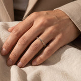 Woman wearing blushing ring stack, delicate beaded ring set styled as everyday jewellery for her