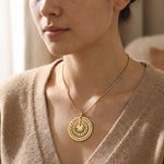 Woman wearing Circle of Loved Ones necklace with personalised engraved pendant