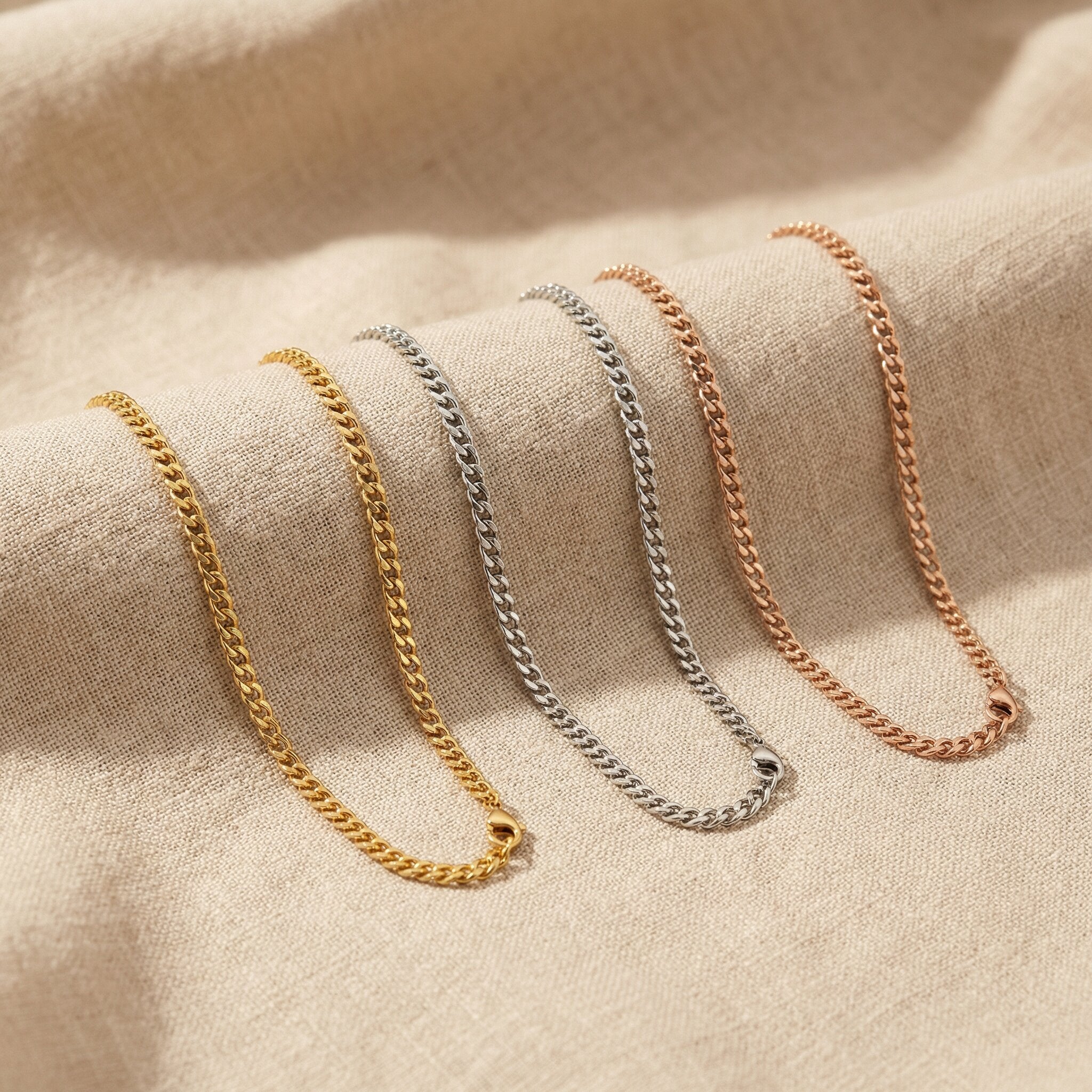 Curb chain necklace in gold, silver and rose gold finishes with flat link design