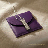 Cylinder cremation necklace displayed with elegant jewelry gift wallet packaging