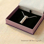 Cylinder cremation necklace presented in elegant jewelry gift box packaging
