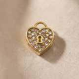 Gold heart lock charm with crystal accents for Moments Bracelet in romantic luxury jewelry style