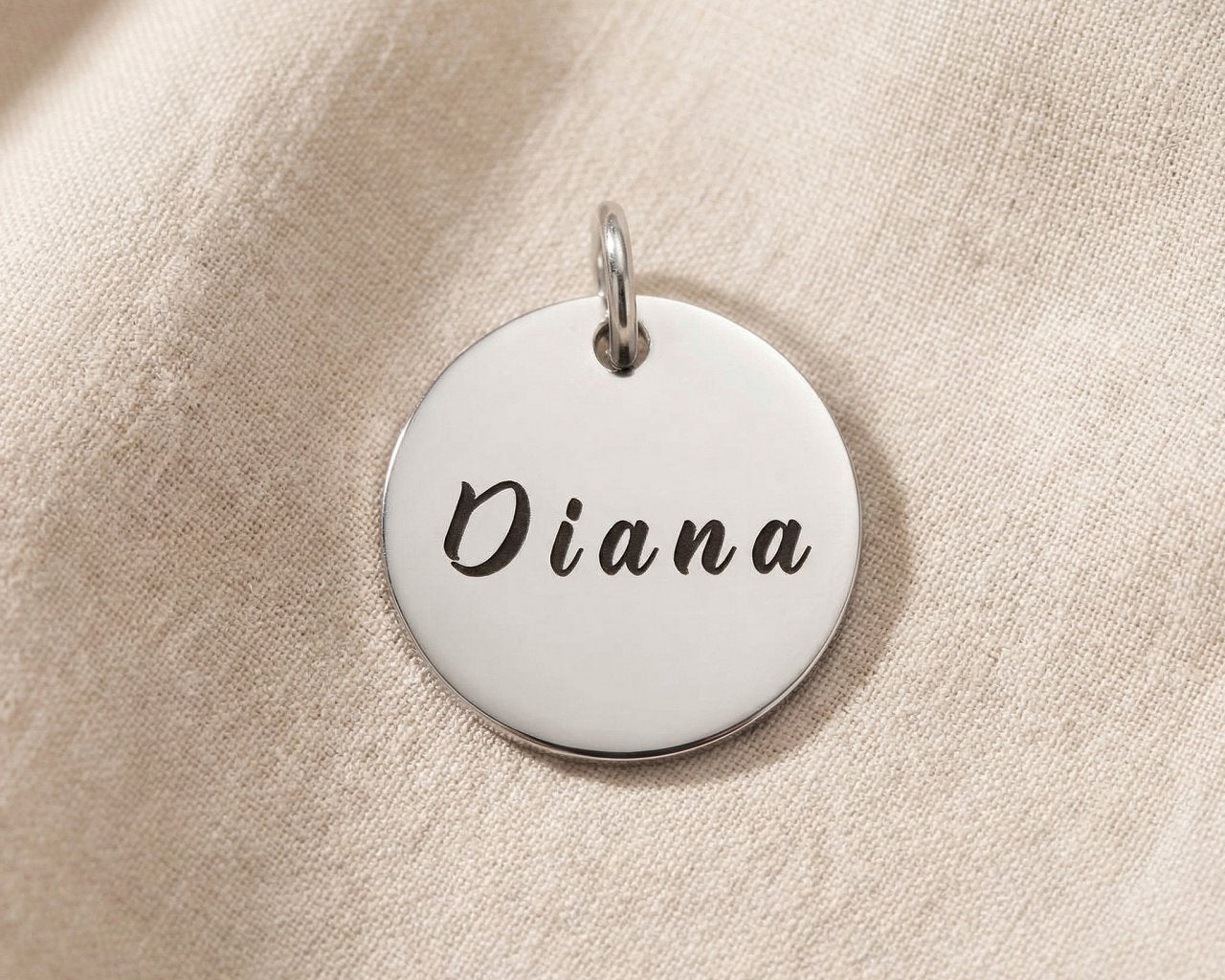 Personalized engraved disc charm for keyring with custom name design and sentimental everyday keepsake