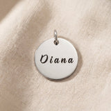 Personalized engraved disc charm for keyring with custom name design and sentimental everyday keepsake