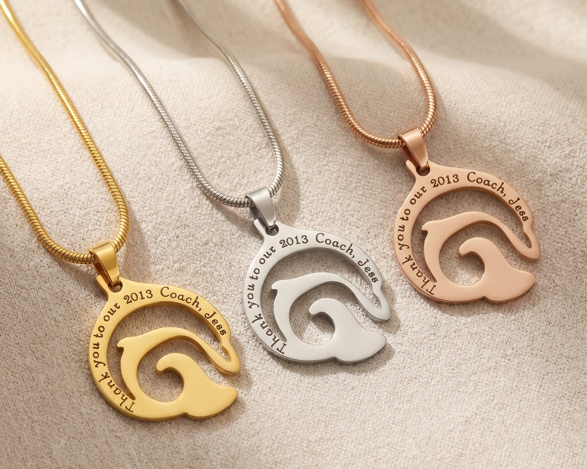 Dolphin necklace tone comparison showing gold, silver and rose gold engraved finishes