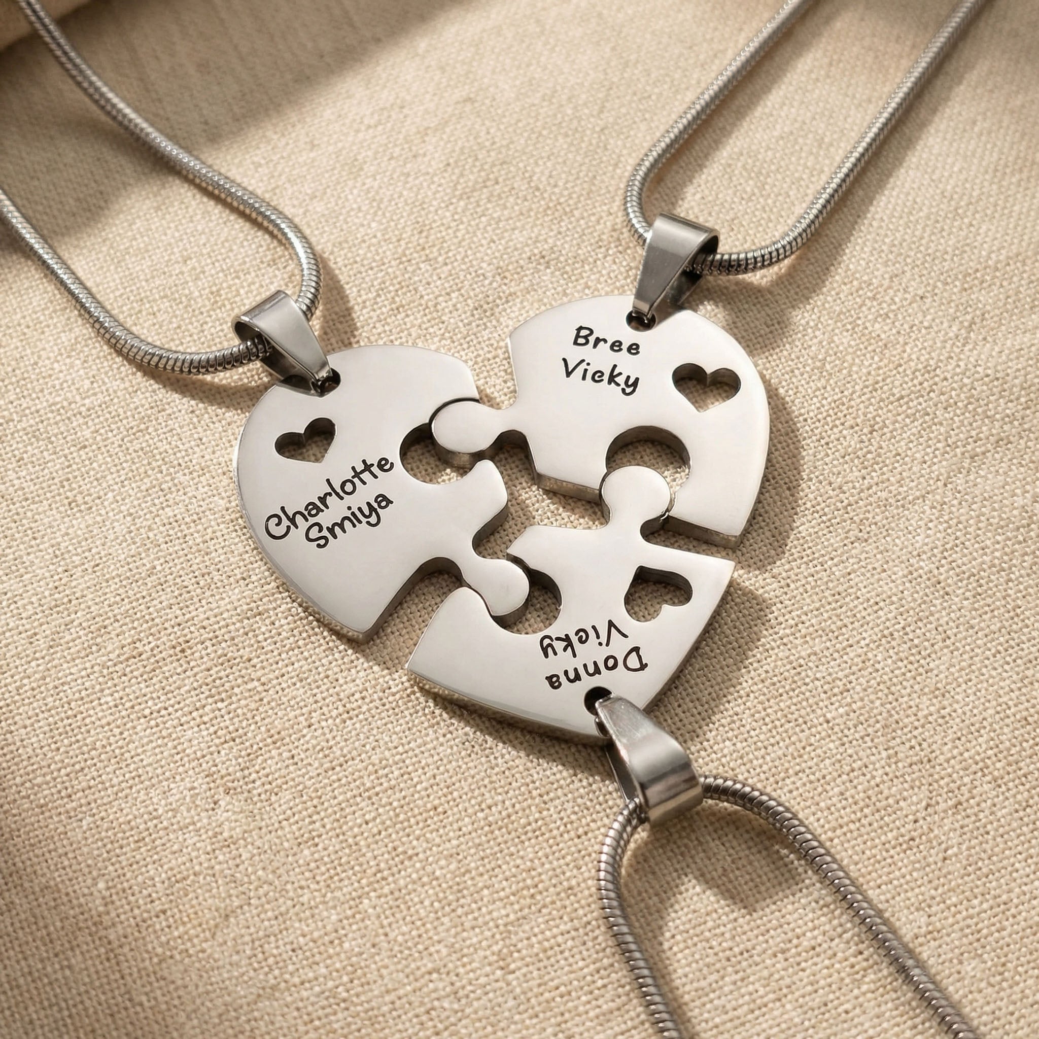 Heart Puzzle Necklace with three engraved pieces forming complete heart pendant design