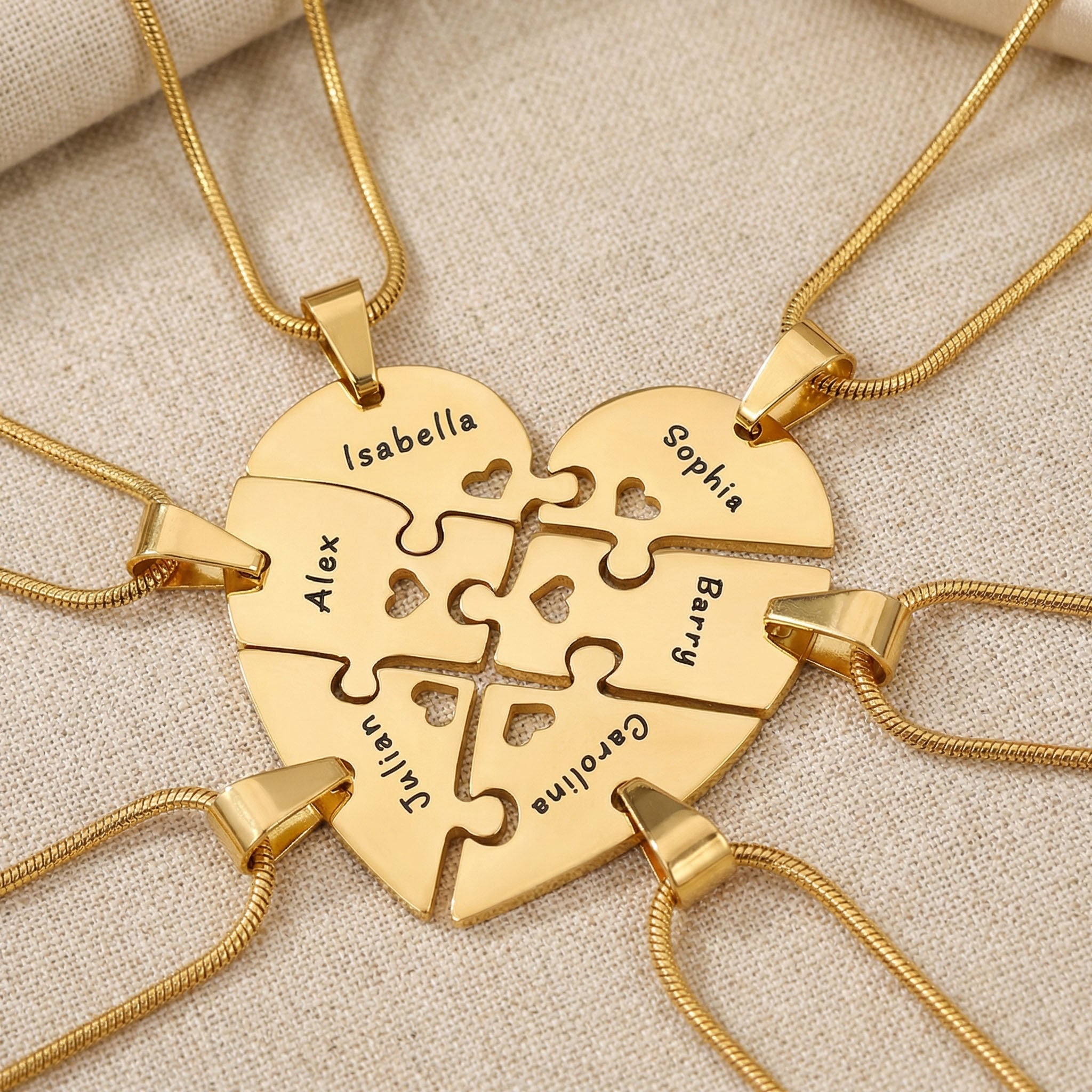 Heart Puzzle Necklace with six gold interlocking engraved pieces forming full heart