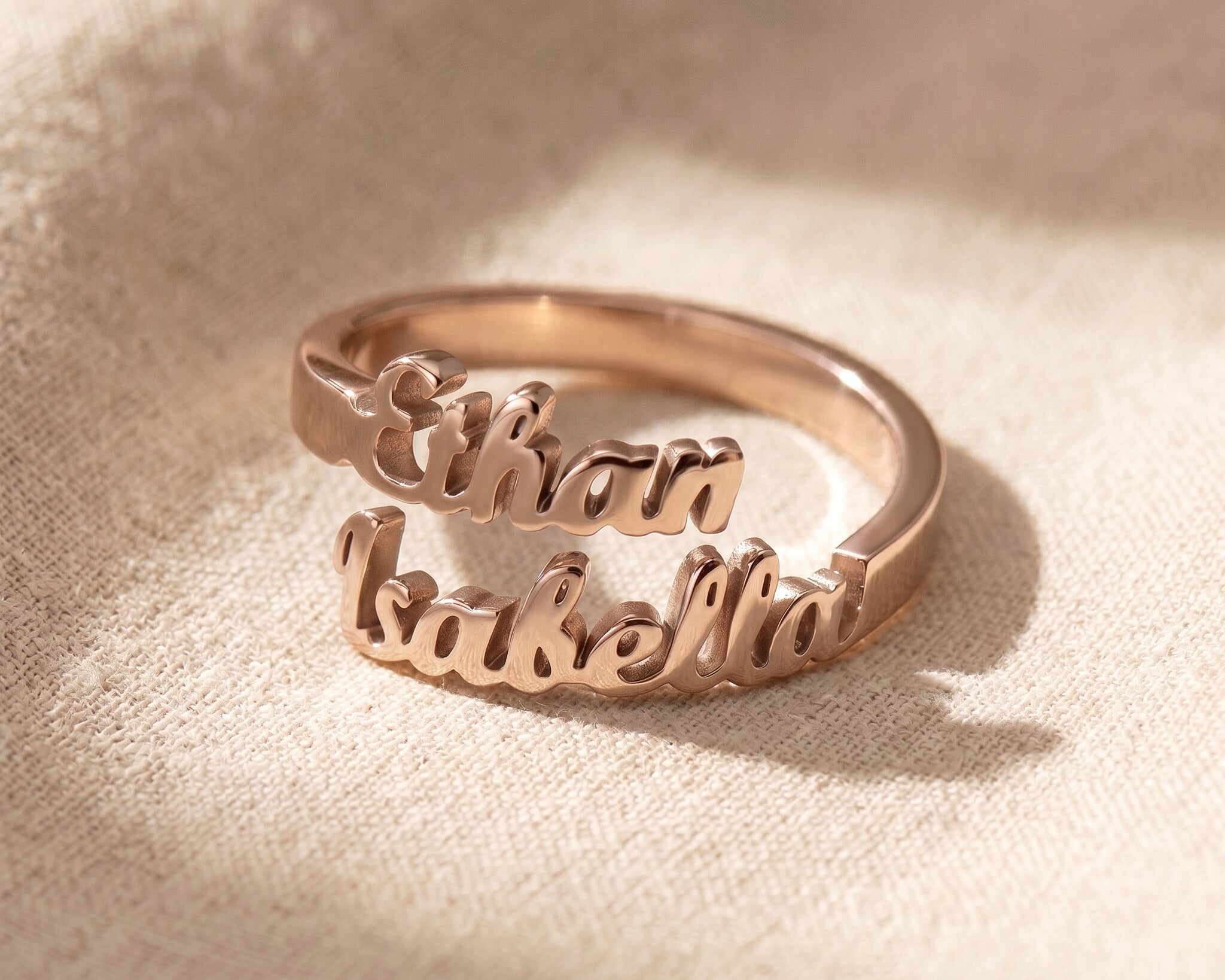 Personalized double name rose gold ring with custom engraved lettering and elegant modern jewelry style