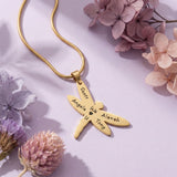 Belle Fever Dragonfly Necklace with Custom Engraved Names in polished gold on soft lavender background with floral accents, symbol of strength and transformation jewellery gift.
