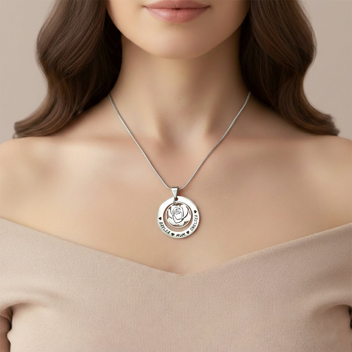 Personalized rose family necklace with engraved family names on model neckline, belle fever elegant family keepsake.