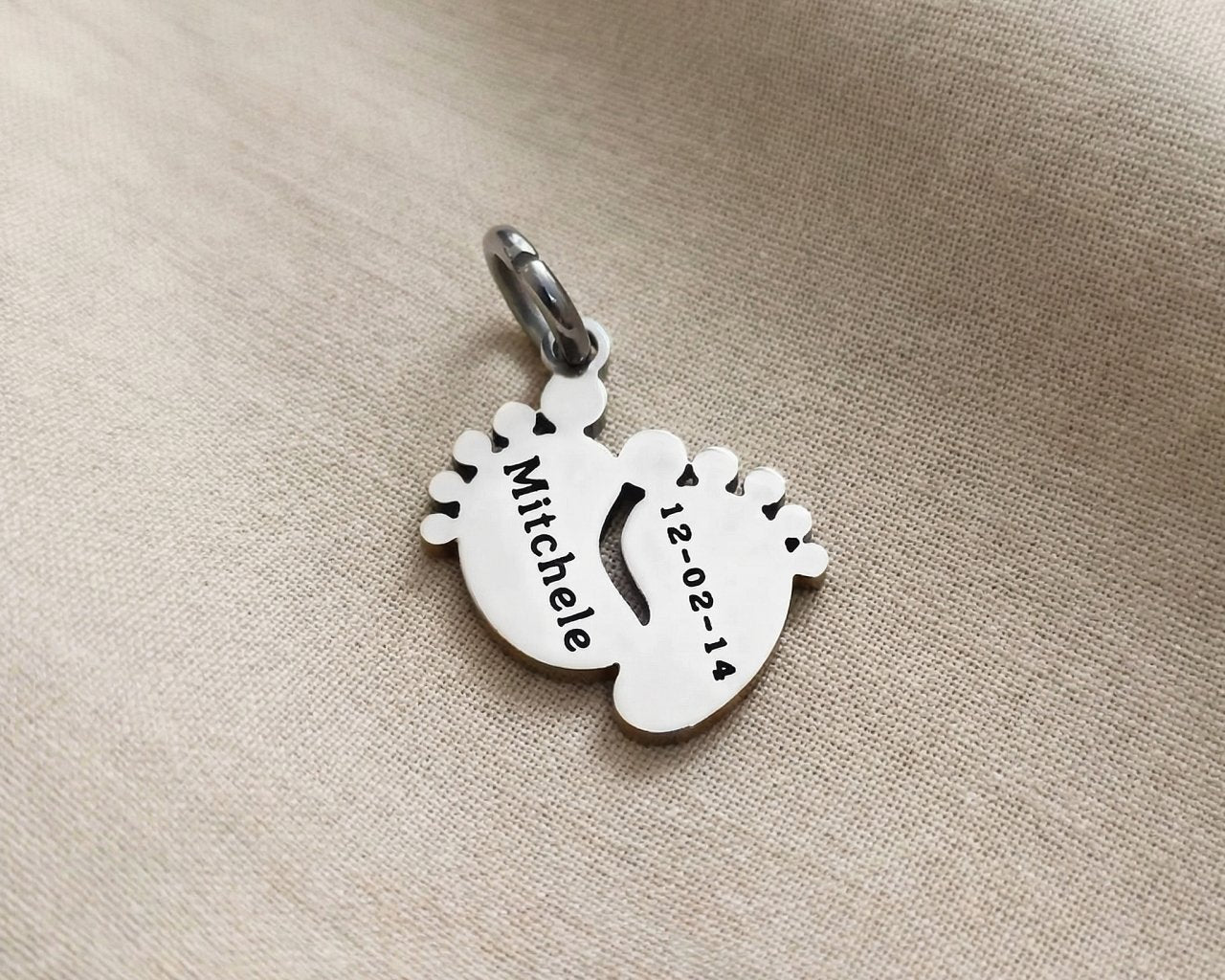 Silver baby feet charm for keyring celebrating newborn memories, motherhood, and precious family milestones