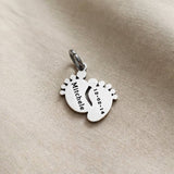 Silver baby feet charm for keyring celebrating newborn memories, motherhood, and precious family milestones