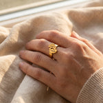Woman wearing footprint ring with engraved detail, personalised jewellery for mum and baby keepsake