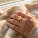 Woman wearing footprint ring with engraved detail, personalised jewellery for mum and baby keepsake