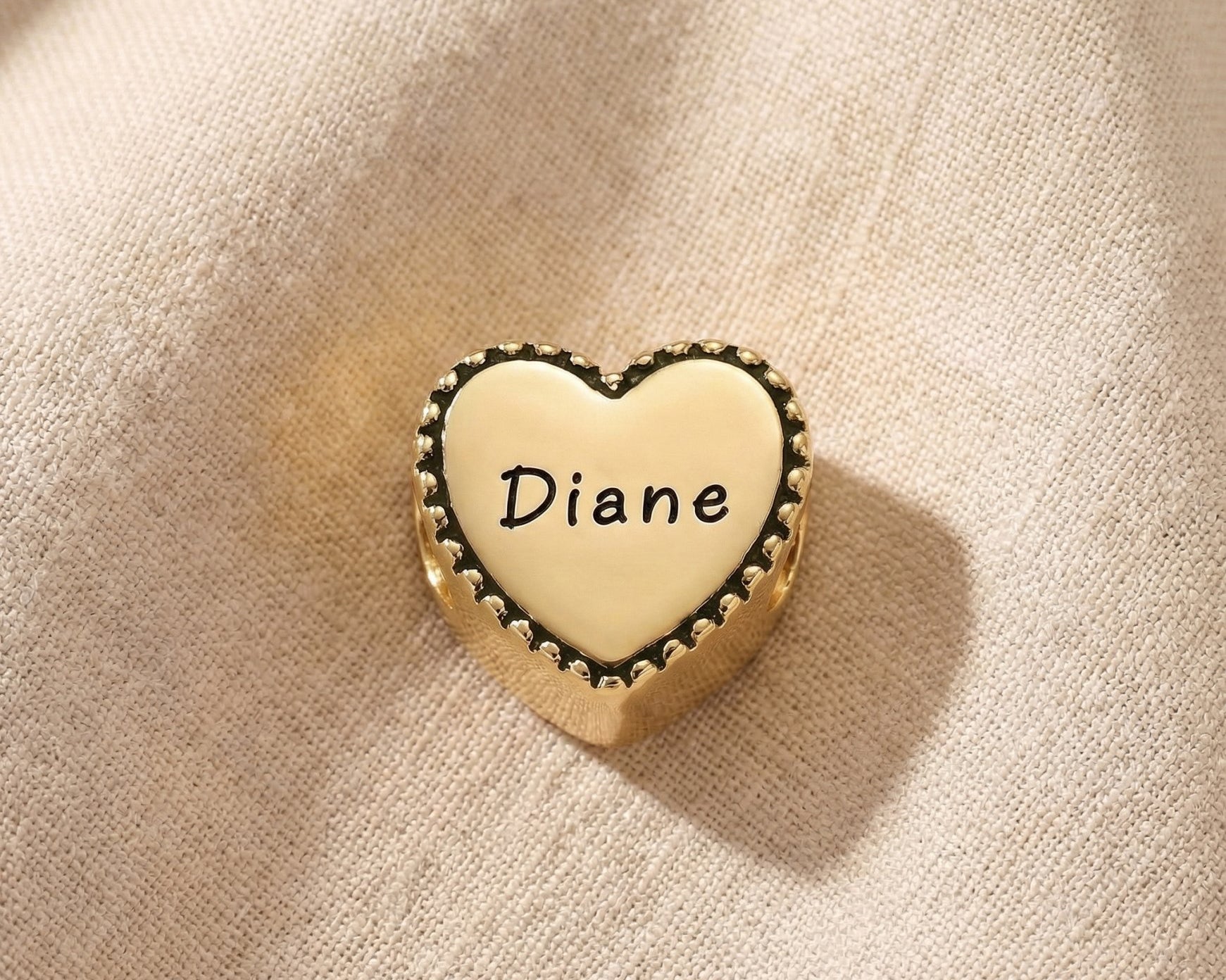 Personalized heart frame charm for Moments Bracelet with engraved name detail and vintage edging