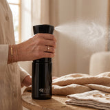 Continuous mist spray bottle in use for hair styling, detangling and everyday hair care routine