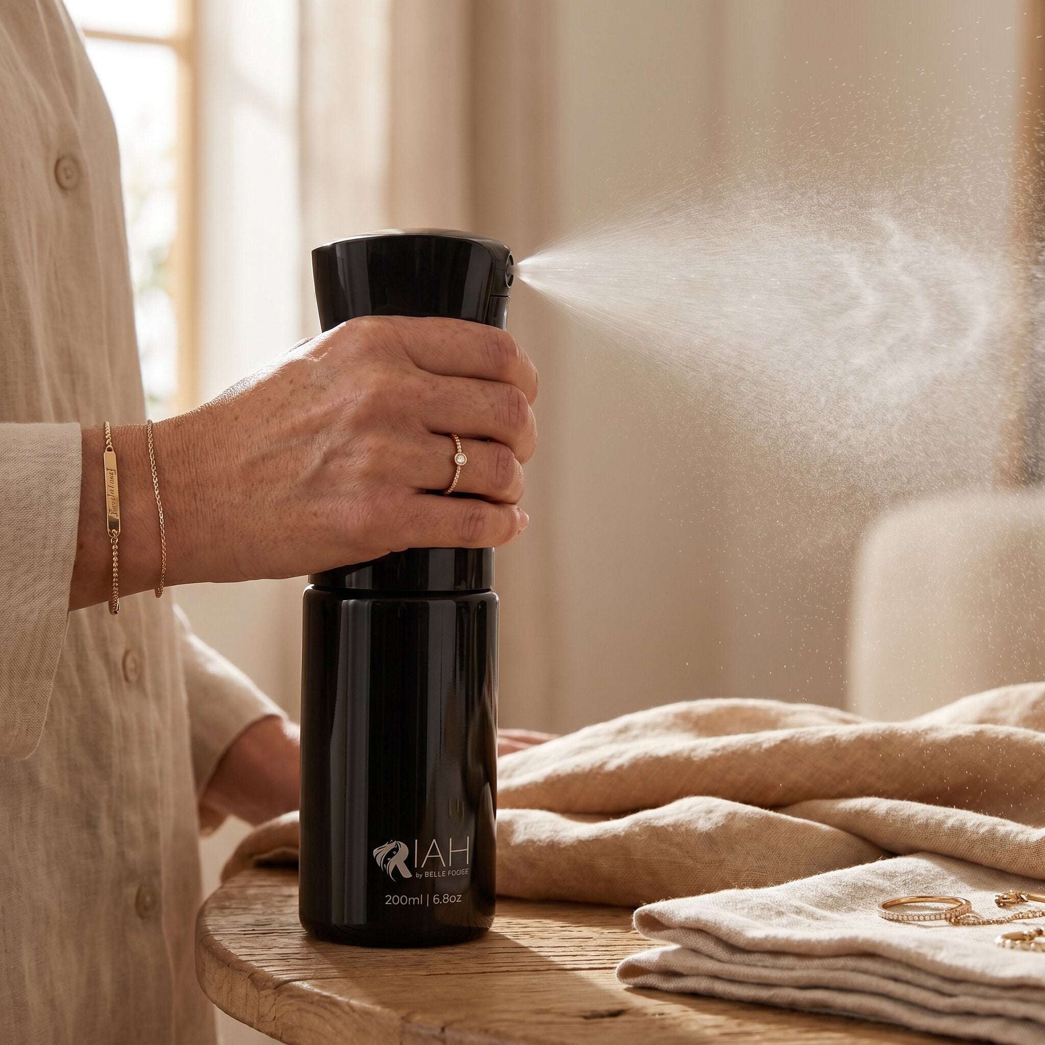 Continuous mist spray bottle in use for hair styling, detangling and everyday hair care routine