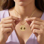 Hand on My Heart Necklace by Belle Fever — engraved gold pendant held at the neckline, a meaningful jewellery piece symbolising love held forever in the heart