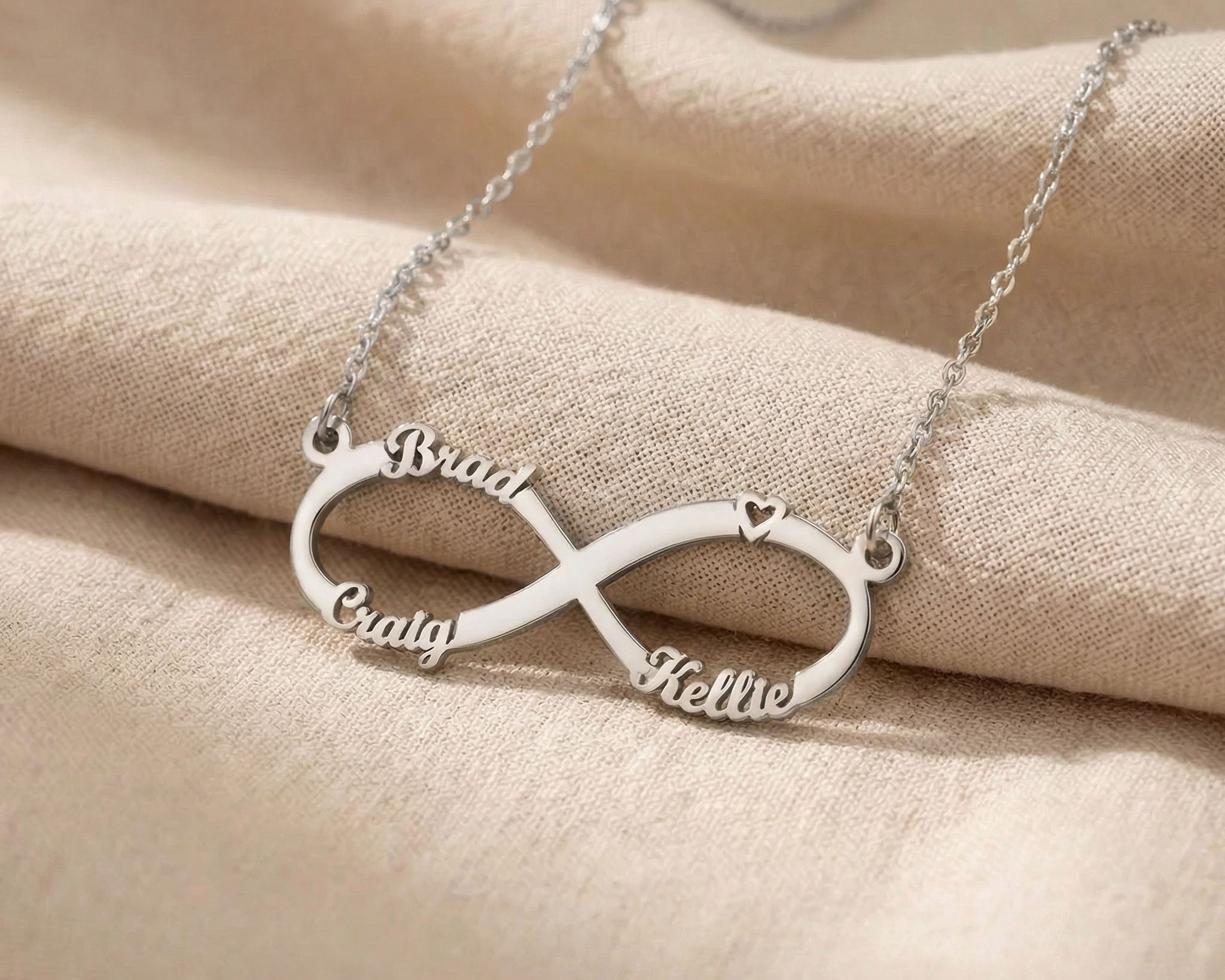 Silver infinity name necklace with custom name on infinity pendant design