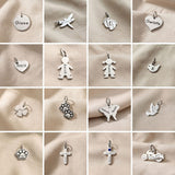 Keyring charms selection showing symbols including hearts, crosses and decorative charm designs