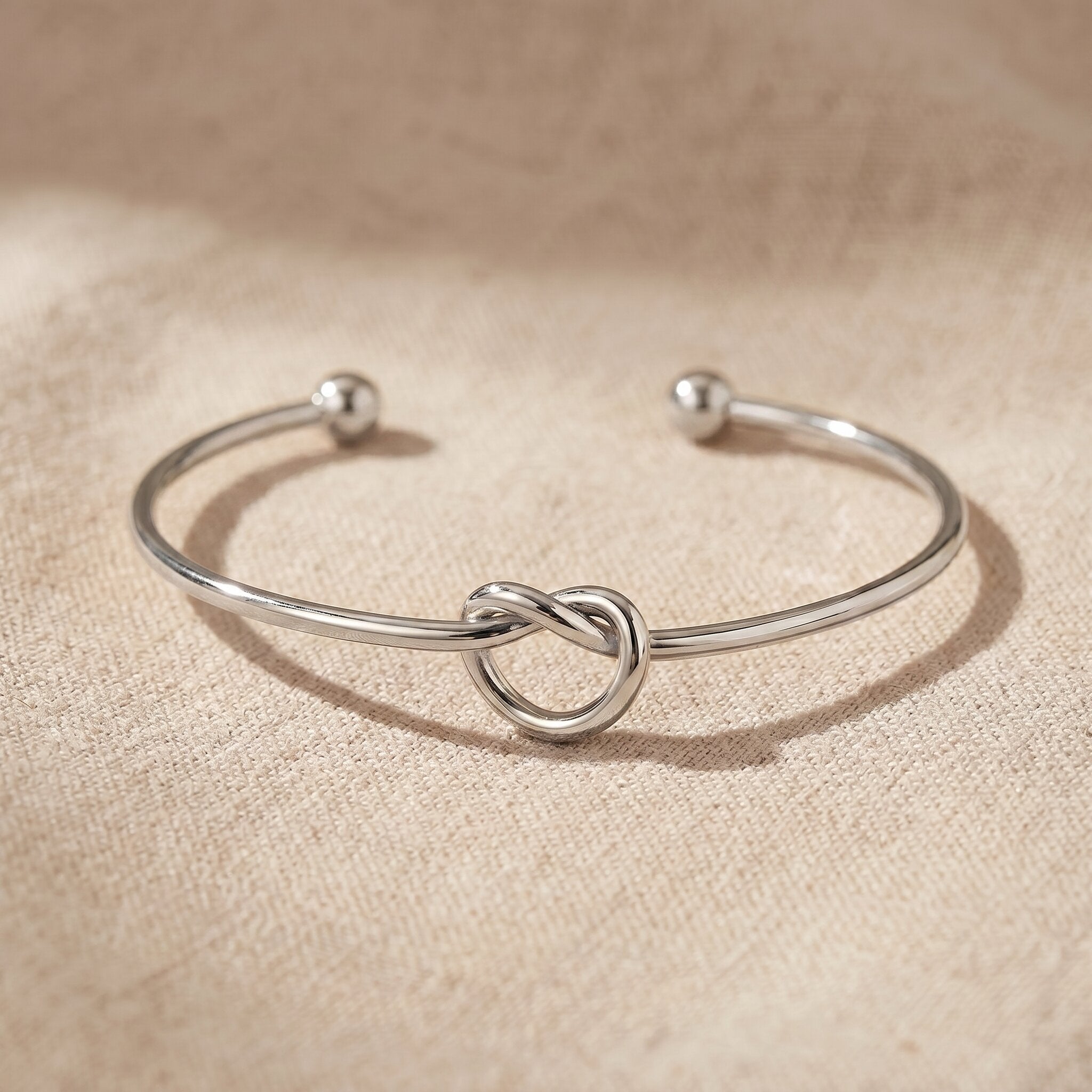 Knot bangle in silver with symbolic knot design, elegant open cuff bracelet gift for her