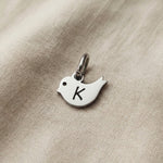 Personalized little bird charm for keyring with engraved initial symbolizing freedom, hope, and remembrance