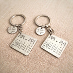 Custom matching calendar keyrings featuring an engraved milestone date and personalised disc charm for couples and loved ones.