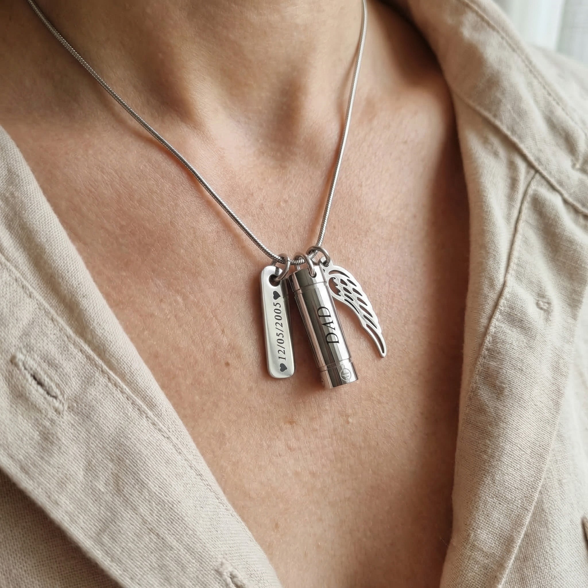 Woman wearing Memory Cremation Necklace with engraved bar pendant, memorial jewellery lifestyle image