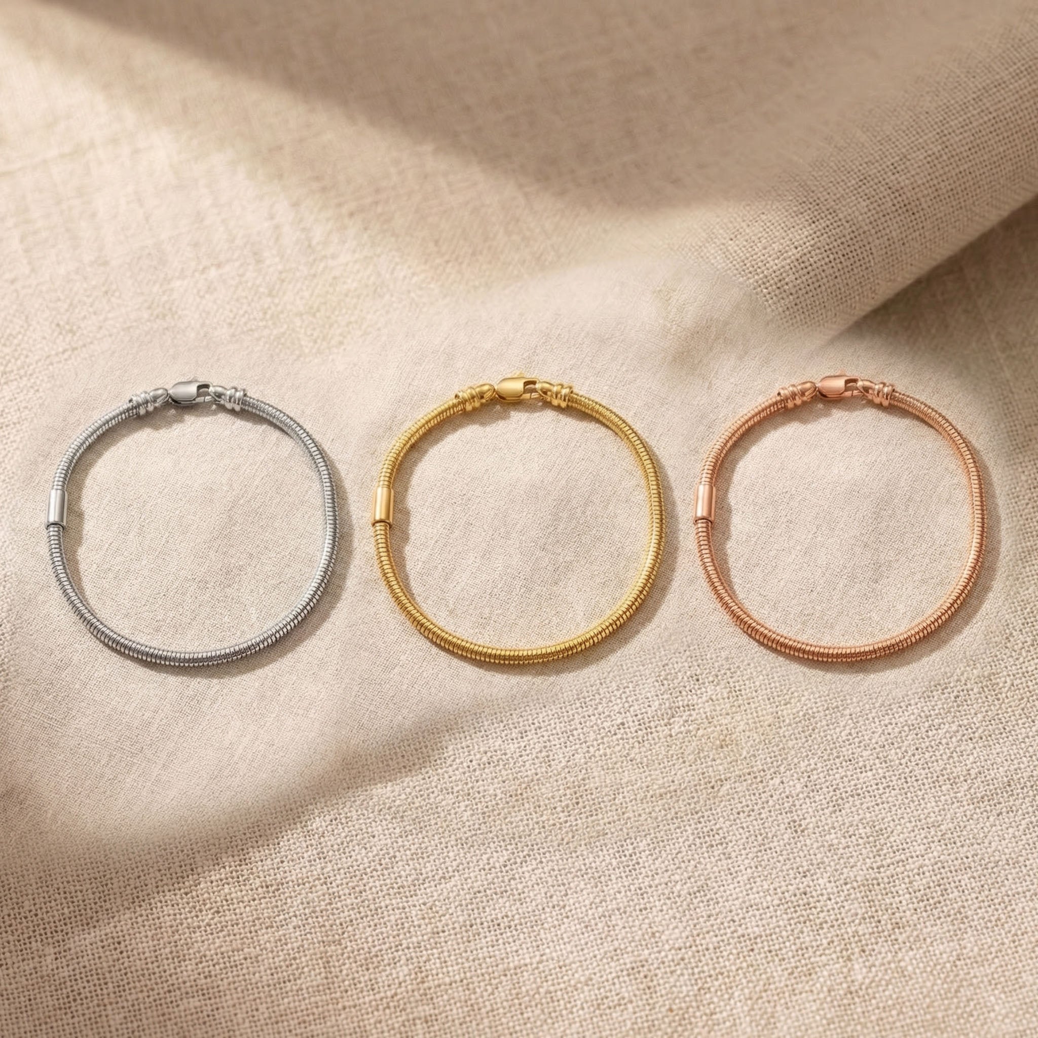 Moments charm bracelet tone comparison showing gold, silver and rose gold finishes